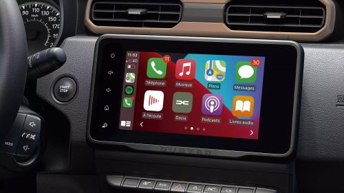 Detailed view of the Dacia Duster's entertainment system, highlighting the touchscreen infotainment display and audio controls.